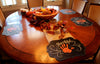 Image of dining holiday table decorated with Thanksgiving placemats with inspirational messages and hand drawn turkey artwork using Chalk Ink wet wipe liquid chalk markers in white and Candy Corn Orange
