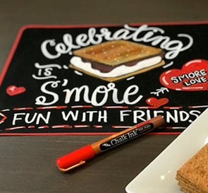 Image of chalkboard paper from Chalk Ink with sign artwork celebrating s'mores