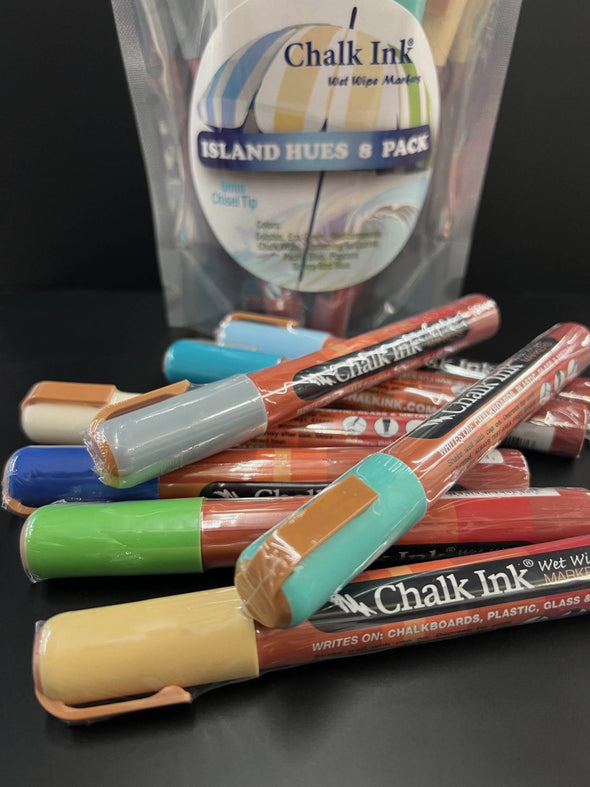 Closeup image of Chalk Ink island hues variety liquid chalk marker pack with packaging standing in background