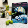 Image of Happy hour menu written on chalkboard paper on countertop using chalk ink liquid chalk markers with colorful striped beach umbrella