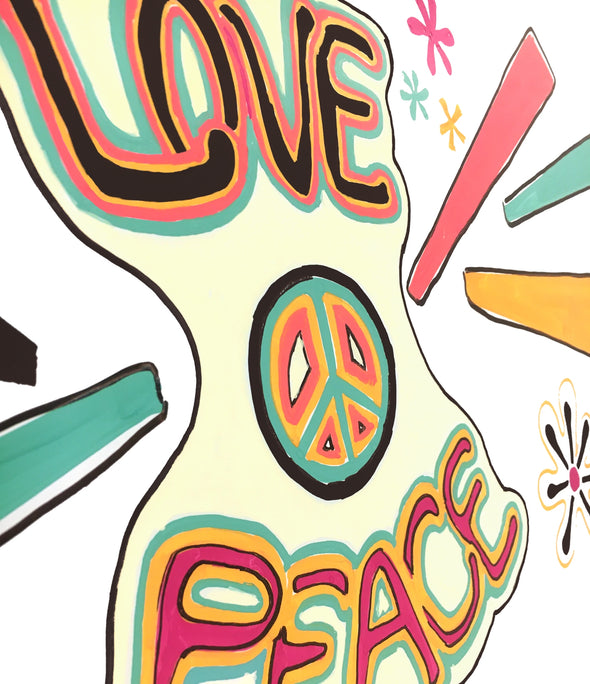Closeup of artwork with the words love and peace and peace sign drawn on a white chalkboard using chalk ink liquid chalk feelin groovy markers